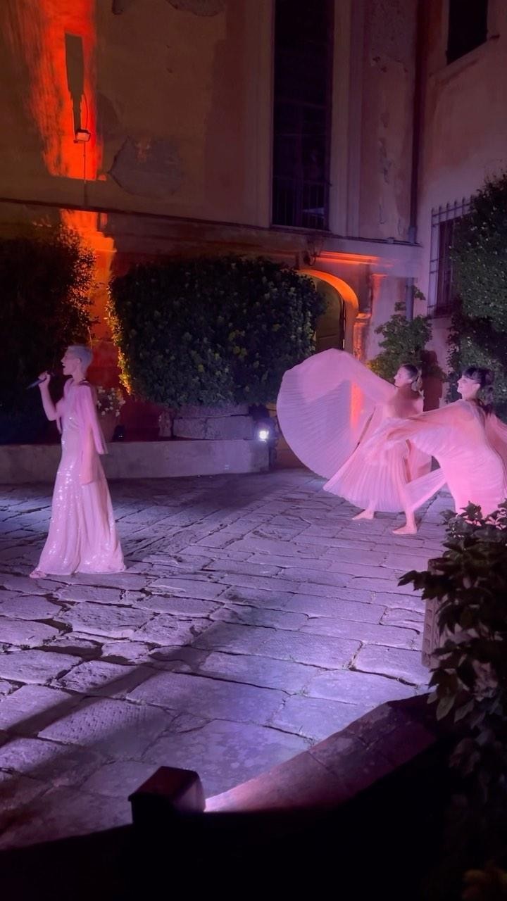 Live performance in a Tuscan villa courtyard at night